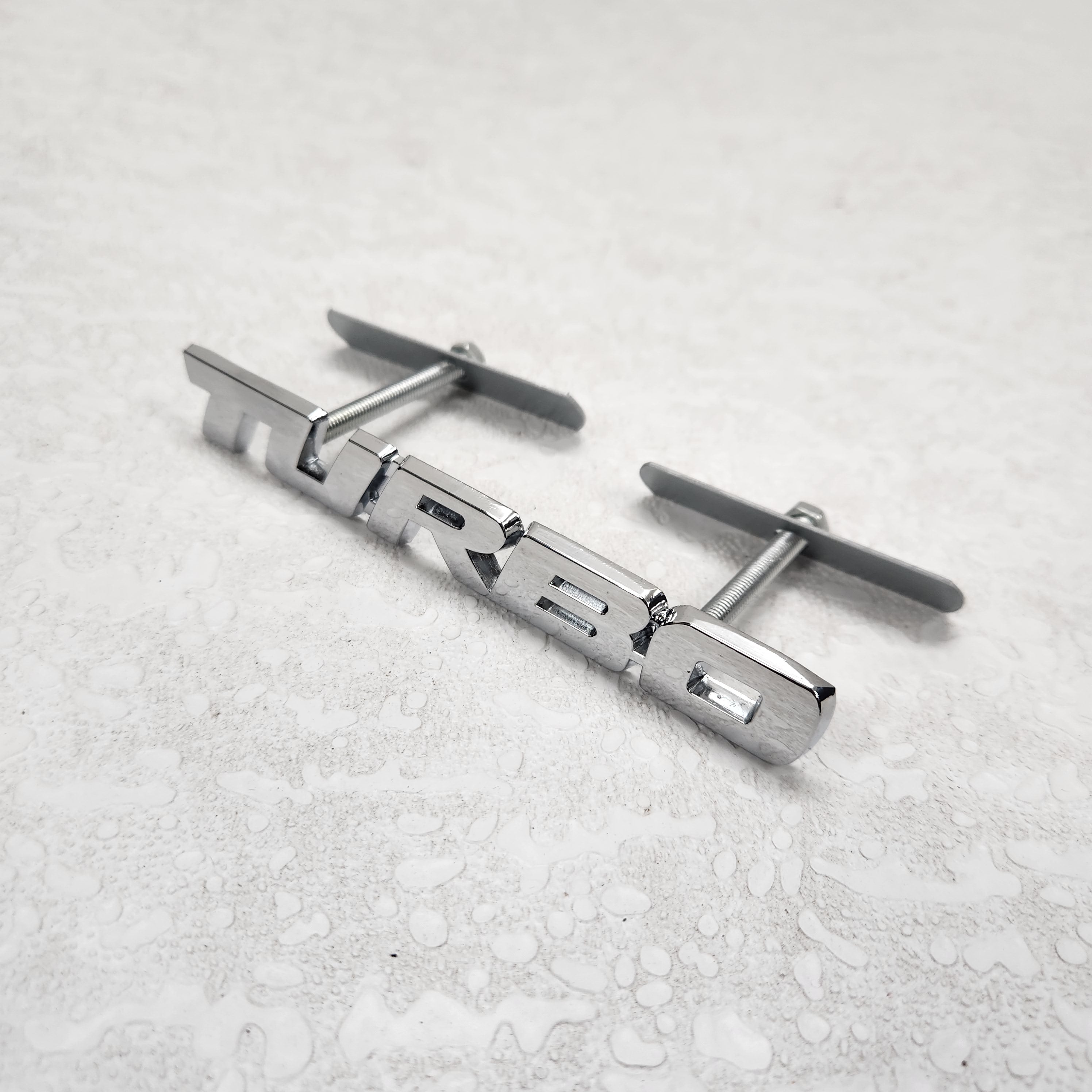 Turbo Silver Grille Metal Emblem (14.9 x 3.2 cm)