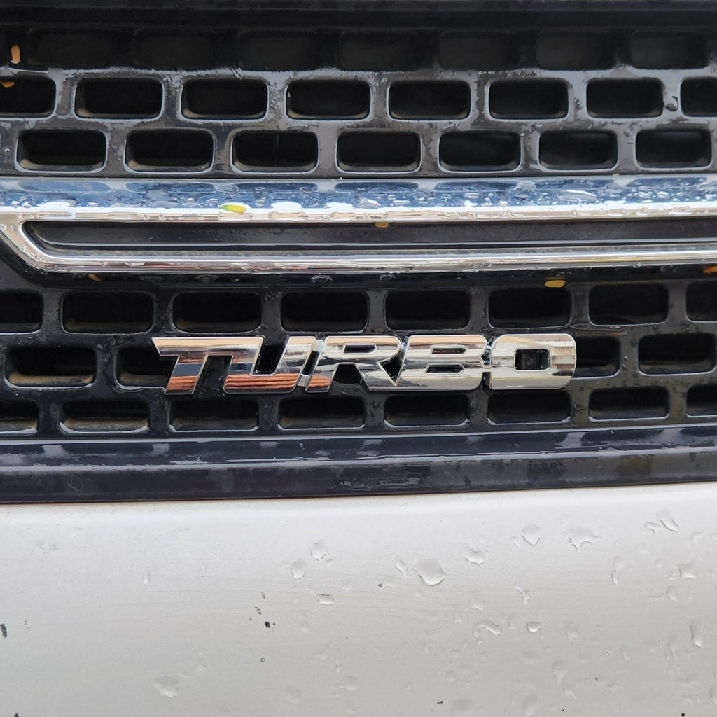 Turbo Silver Grille Metal Emblem (14.9 x 3.2 cm)